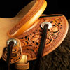 Wade tree, 15 inch seat, Gullet - 7 and 1/2 inch by 6 and 1/4 inch by 4 inch, Horn 4&1/2 inch round, 90 degree bars, 7/8ths full in-skirt riggin, Cheyenne Roll, Buckaroo outside leathers, half-breed Wade Saddle built and tooled with original floral and border design by Keith Valley.